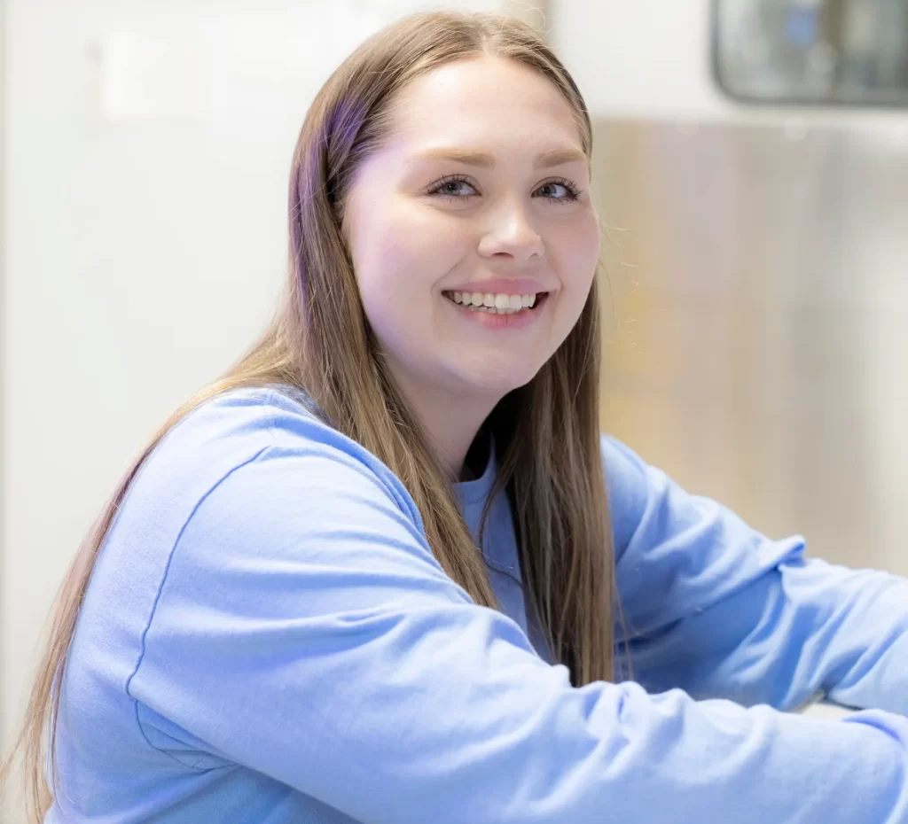 vet smiling while looking after animals